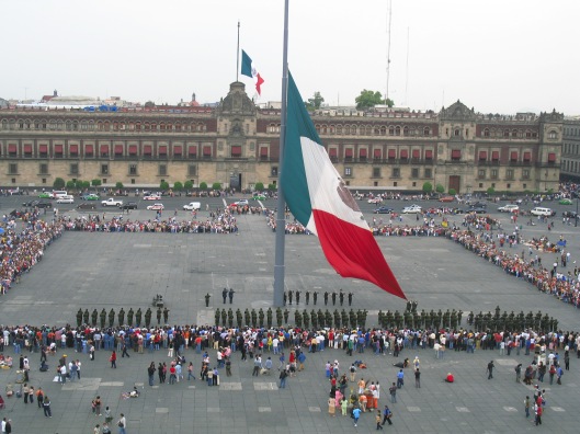 The Zócalo ~ taking the flag down