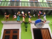 puppets dangle from balconies