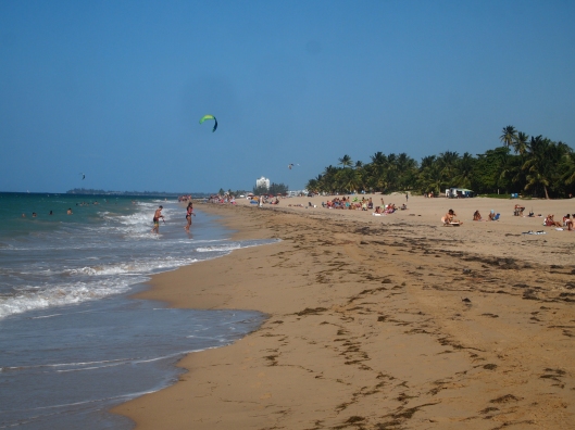 sunbathers and kite boarders